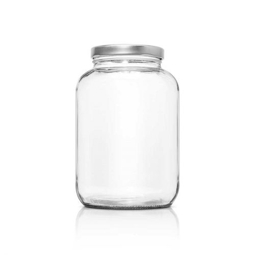 Ein leeres bauchiges Glas mit silbernen Deckel